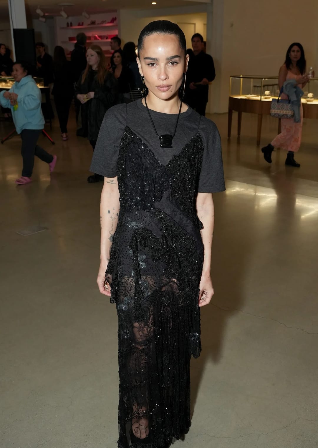 The combination of a T-shirt and a slip dress worn over the top has returned to fashion