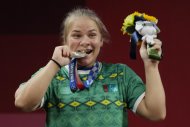 Фоторепортаж: Тяжелоатлетка Полина Гурьева из Туркменистана завоевала олимпийское серебро в Токио