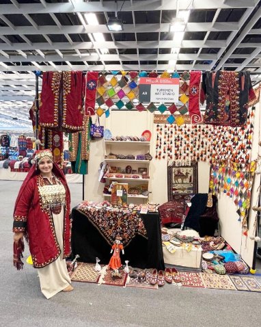 A needlewoman from Turkmenistan takes part in the international exhibition-fair of crafts in Florence